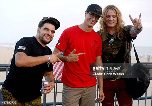 Heroes Julian Torres, Charlie Lindell and singer Sebastian Bach attend the Cycle for Heroes event to benefit The Heroes Project at Santa Monica Pier...