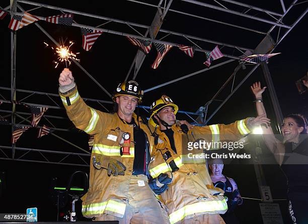 Santa Monica firefighters celebrate after the Cycle for Heroes event to benefit The Heroes Project at Santa Monica Pier on September 11, 2015 in...