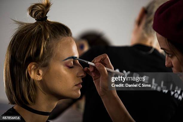 Model has make up applied backstage during the Chromat featuring Intel Collaboration show at Milk Studios on September 11, 2015 in New York City.