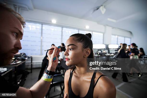 Model has make up applied backstage during the Chromat featuring Intel Collaboration show at Milk Studios on September 11, 2015 in New York City.