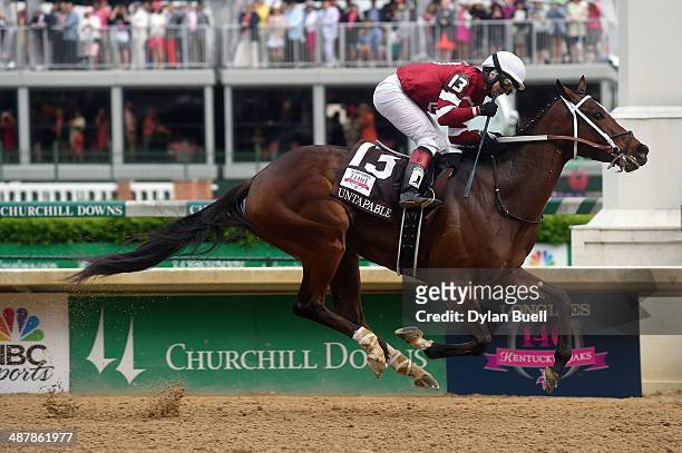 Untapable, ridden by Rosie Napravnik, crosses the finish line to win the 140th running of the Kentucky Oaks at Churchill Downs on May 2, 2014 in...