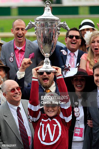 Jockey Rosie Napravnik celebrates with the trophy in the winners circle after guiding Untapable to win the 140th running of the Kentucky Oaks at...