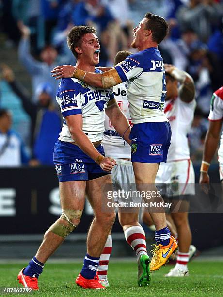 Shaun Lane of the Bulldogs celebrates his try with team mate Damien Cook during the NRL Elimination Final match between the Canterbury Bulldogs and...