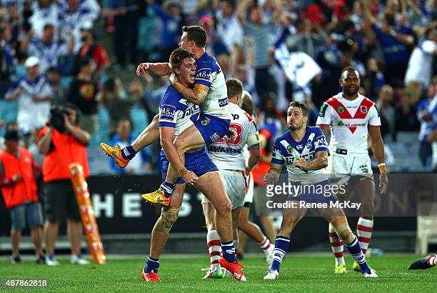 Shaun Lane of the Bulldogs celebrates his try with team mate Damien Cook during the NRL Elimination Final match between the Canterbury Bulldogs and...