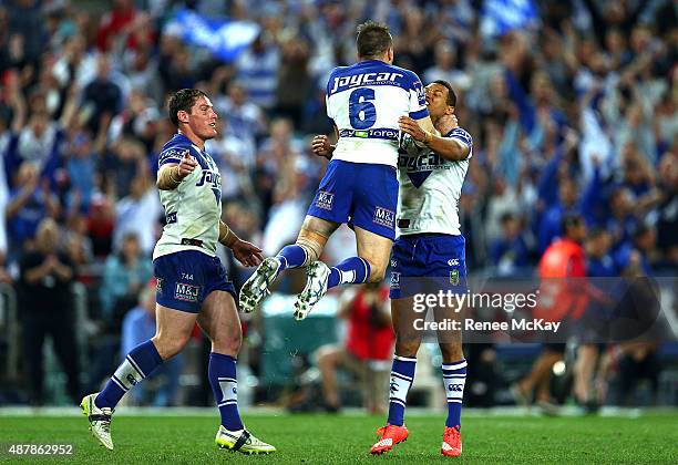 Josh Reynolds celebrates his winning field goal with Josh Jackson and Moses Mbye during the NRL Elimination Final match between the Canterbury...