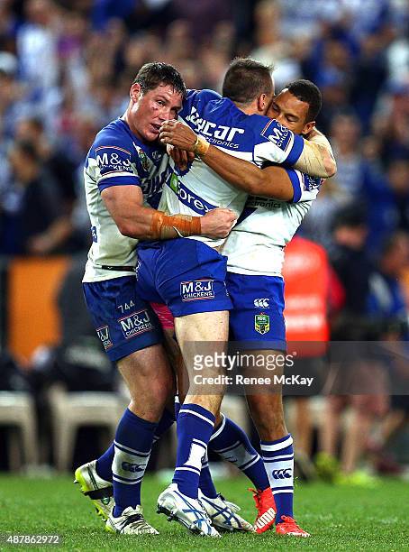 Josh Reynolds celebrates his winning field goal with Josh Jackson and Moses Mbye during the NRL Elimination Final match between the Canterbury...