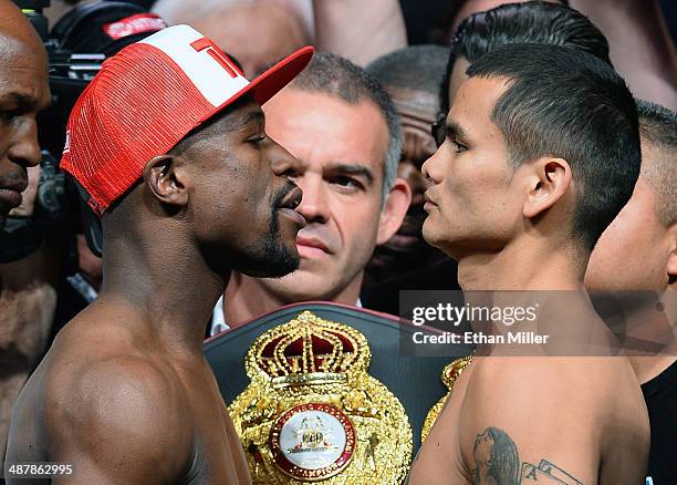 Welterweight champion Floyd Mayweather Jr. And WBA champion Marcos Maidana face off during their official weigh-in at the MGM Grand Garden Arena on...