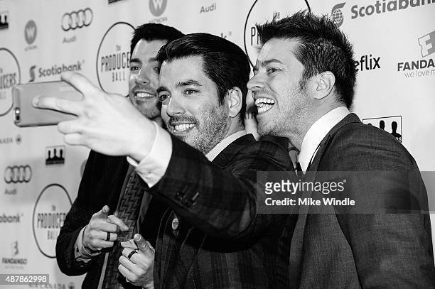 Actors Jonathan Scott, Drew Scott and J.D. Scott stop to take a selfie during the 5th Annual Producers Ball presented by Scotiabank in support of The...