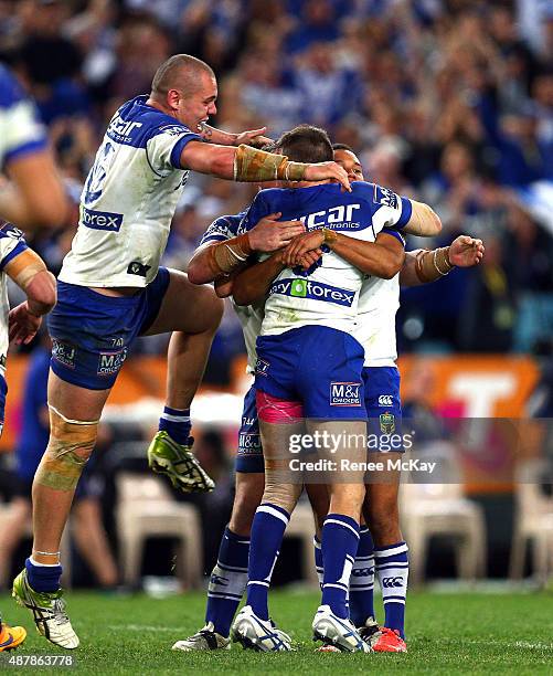 Josh Reynolds celebrates his winning field goal with Josh Jackson, Moses Mbye and David Klemmer during the NRL Elimination Final match between the...