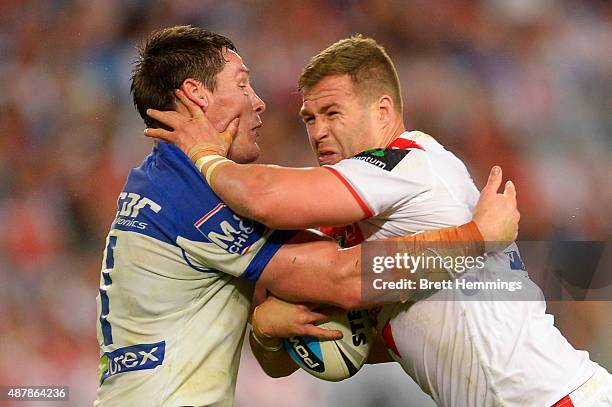 Trent Merrin of the Dragons is tackled during the NRL Elimination Final match between the Canterbury Bulldogs and the St George Illawarra Dragons at...