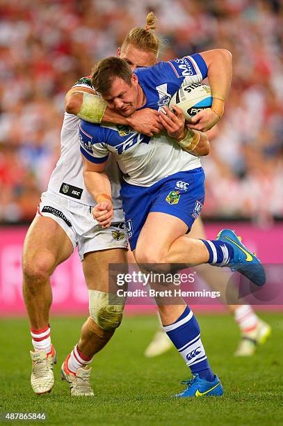 Josh Morris is tackled during the NRL Elimination Final match between the Canterbury Bulldogs and the St George Illawarra Dragons at ANZ Stadium on...