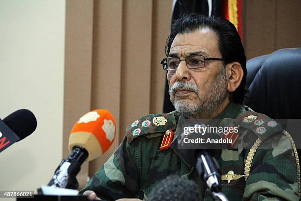 Libyan commander Salim al-Ubeyde speaks in a press conference after a clash happened between security forces and Ansar al-Sharia members in Benghazi,...