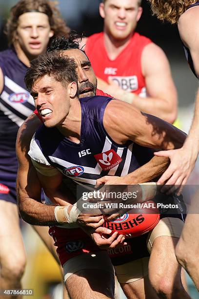 Garrick Ibbotson of the Dockers is tackled by Adam Goodes of the Swans during the First AFL Qualifying Final match between the Fremantle Dockers and...