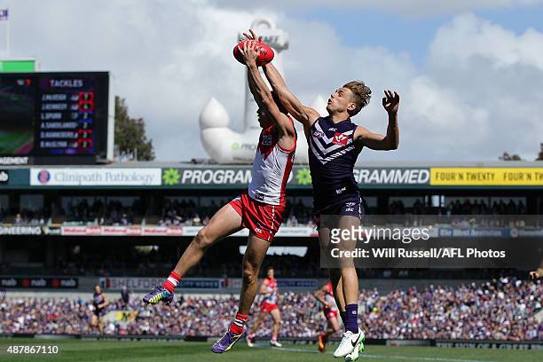 Jake Lloyd of the Swans takes a mark in front of Tom Sheridan of the Dockers during the First AFL Qualifying Final match between the Fremantle...