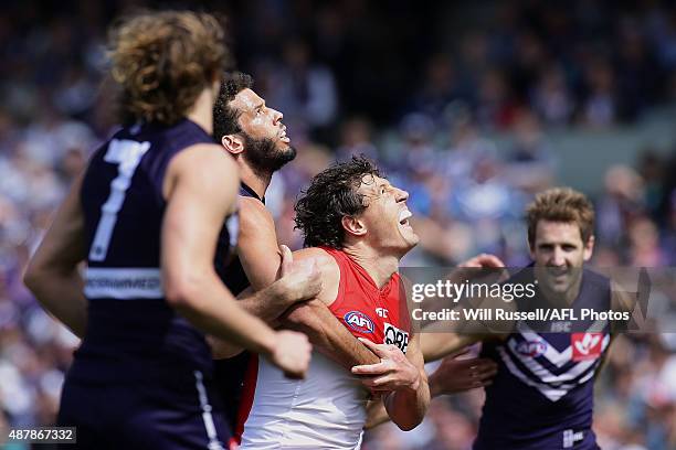 Zac Clarke of the Dockers contests a ruck with Kurt Tippett of the Swans during the First AFL Qualifying Final match between the Fremantle Dockers...