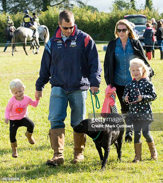 Autumn Phillips and Peter Phillips with Savannah Phillips and Isla Phillips attend the Whatley Manor International Horse Trials at Gatcombe Park on...