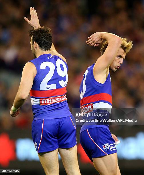 Tory Dickson of the Bulldogs celebrates a goal with Mitch Wallis during the 2015 AFL Second Elimination Final match between the Western Bulldogs and...