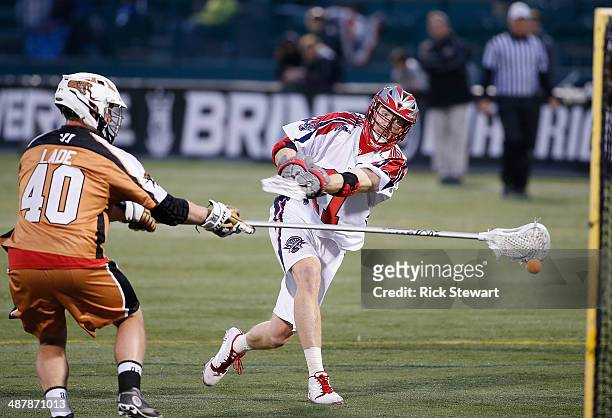 Brodie Merrill of the Boston Cannons shoots against John Lade of the Rochester Rattlers at Sahlen's Stadium on May 2, 2014 in Rochester, New York.