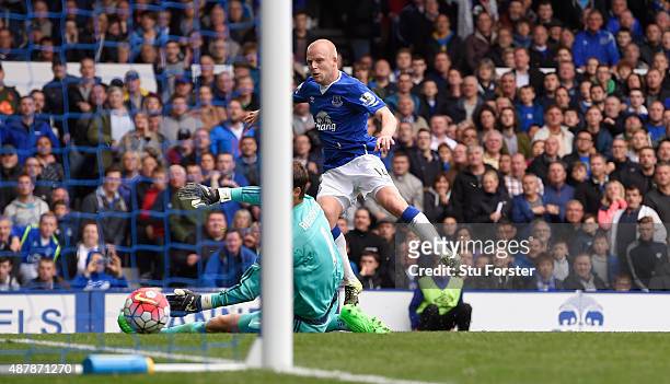 Steven Naismith of Everton scores his hat trick goal past goalkeeper Asmir Begovic of Chelsea during the Barclays Premier League match between...