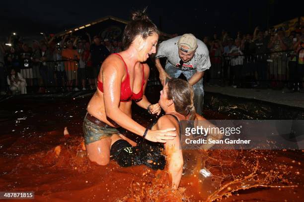 Fans wrestle in barbecue sauce in the infield following qualifying for the NASCAR Nationwide Series Aaron's 312 at Talladega Superspeedway on May 2,...