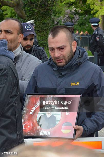 Nearly 600 people attend the march held by friends of Diren to commemorate him, in Hamburg, Germany on May 2, 2014. Relatives of Diren burst into...