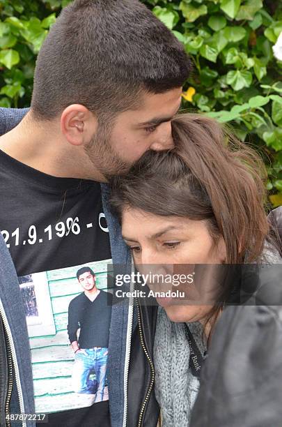 Gulcin Dede , mother of Turkish boy Diren Dede killed in the United States, tries to stand during the march held by friends of Diren to commemorate...