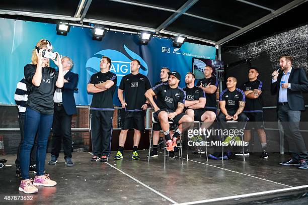 All Blacks players watch the first showing of the Haka 360 Experience at the Launch Event at Oxo Tower Wharf South Wharf on September 12, 2015 in...