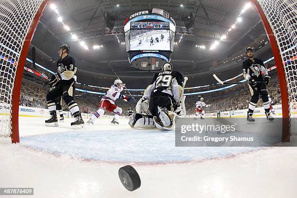 Marc-Andre Fleury of the Pittsburgh Penguins reacts after giving up a goal by Benoit Pouliot of the New York Rangers in Game One of the Second Round...
