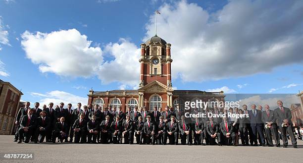 Players and management of the England 2015 World Cup Rugby squad pose with their caps at Sandhurst Millitary College for their official welcoming...