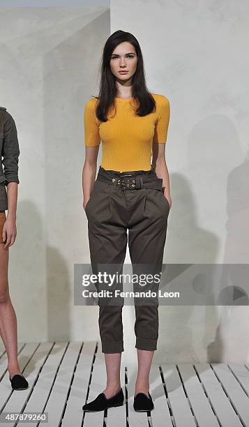 Model poses for pictures during the Frame Denim presentation during Spring 2016 New York Fashion Week on September 12, 2015 in New York City.