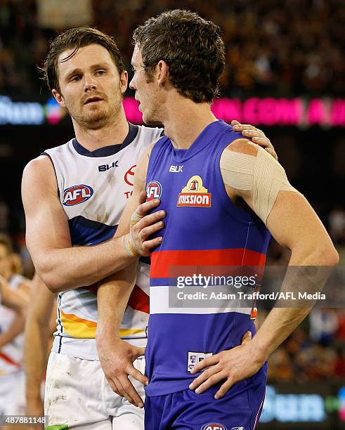 Patrick Dangerfield of the Crows shakes hands with Robert Murphy of the Bulldogs after the 2015 AFL Second Elimination Final match between the...