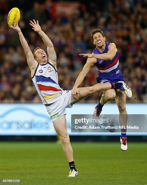 Tom Lynch of the Crows and Matthew Boyd of the Bulldogs compete for the ball during the 2015 AFL Second Elimination Final match between the Western...