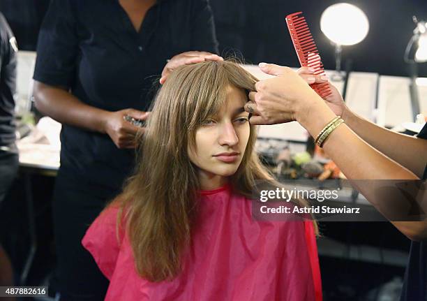 Model prepares backstage with TRESemme at the Rebecca Minkoff Runway Show SS 16 at The Gallery, Skylight at Clarkson Sq on September 12, 2015 in New...