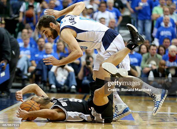 Tony Parker of the San Antonio Spurs commits a backcourt violation in front of Jose Calderon of the Dallas Mavericks in Game Six of the Western...