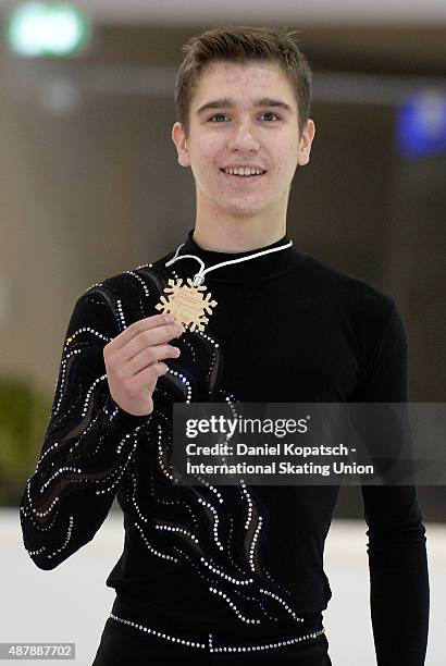 Ivan Pavlov of Ukraine poses during junior men medal ceremony of ISU Junior Grand Prix of figure skating on September 12, 2015 in Linz, Austria.