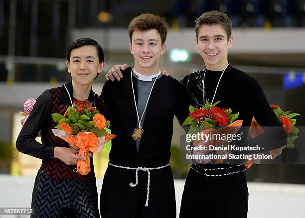 Vincent Zhou of the United States , Dimitri Aliev of Russia and Ivan Pavlov of Ukraine pose during junior men medal ceremony of ISU Junior Grand Prix...