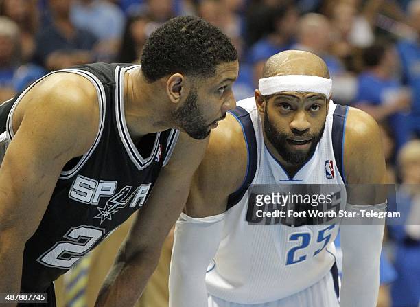 San Antonio Spurs forward Tim Duncan and Dallas Mavericks guard Vince Carter talk late in Game 6 of an NBA Western Conference quarterfinal at the...