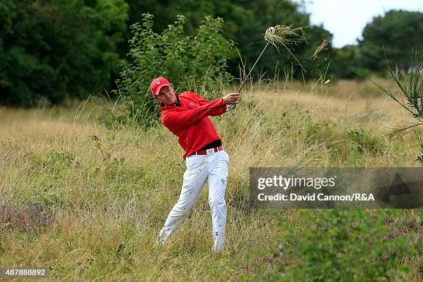 Maverick McNealy of the United States plays his second shot on the 7th hole in his match against Ewen Ferguson of the Great Britain and Ireland Team...