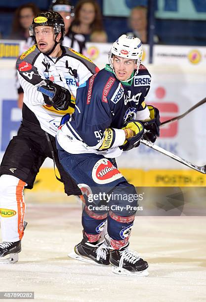 Robert Lembacher of Dornbirner Eishockey Club and Miha Verlic of EC VSV during the game between EC VSV and Dornbirner Eishockey Club on september 12,...