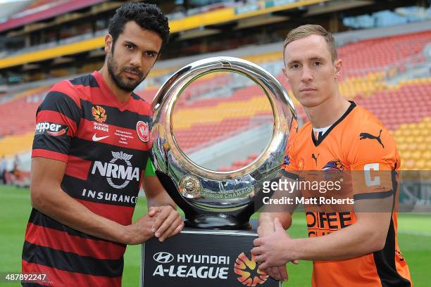 Nikolai Topor-Stanley of the Wanderers and Matthew Smith of the Roar pose with the champions trophy after the A-League Grand Final preview press...