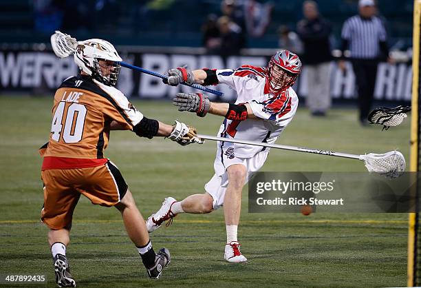 Brodie Merrill of the Boston Cannons shoots against John Lade of the Rochester Rattlers at Sahlen's Stadium on May 2, 2014 in Rochester, New York....