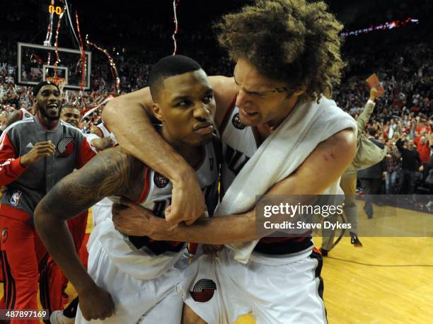 Damian Lillard of the Portland Trail Blazers celebrates with Robin Lopez of the Portland Trail Blazers after Lilliard hit a last second shot to win...