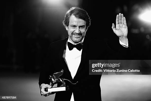 Director Lorenzo Vigas poses with the Golden Lion Award for Best Film for his movie 'From Afar' as he attends the award winners photocall during the...