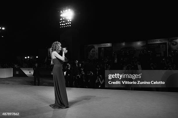 Valeria Golino with her Coppa Volpi award for Best Actress for 'Per Amore Vostro' attends the award winners photocall during the 72nd Venice Film...