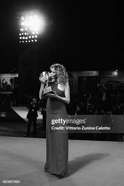 Valeria Golino with her Coppa Volpi award for Best Actress for 'Per Amore Vostro' attends the award winners photocall during the 72nd Venice Film...