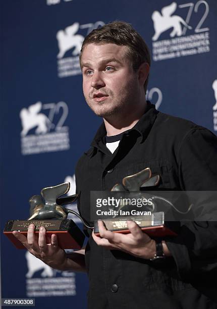 Director Brady Corbet poses with Orizzonti award for Best Director and 'Luigi de Laurentis' Venice Award for a Debut Film for his movie 'The...