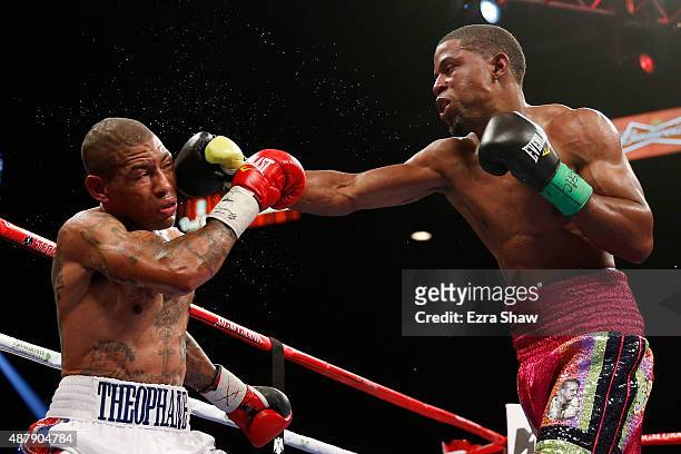 Steven Upsher connects with a right to Ashley Theophane during their junior welterweight fight at MGM Grand Garden Arena on September 12, 2015 in Las...