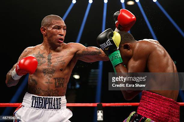 Ashley Theophane throws a left at Steven Upsher during their junior welterweight fight at MGM Grand Garden Arena on September 12, 2015 in Las Vegas,...