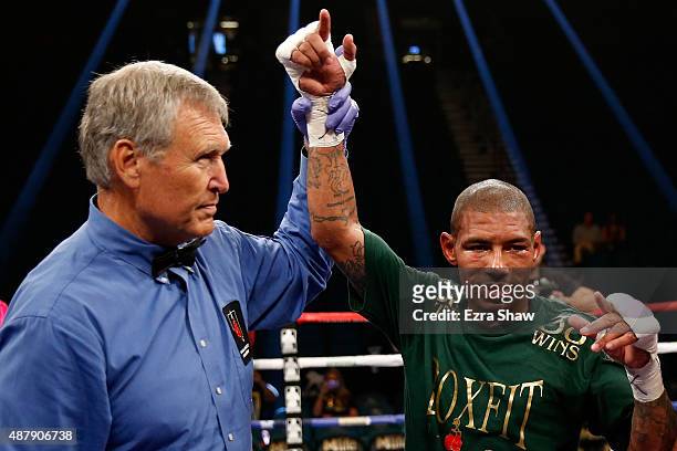 Ashley Theophane has his arm lifted by referee Jay Nady after defeating Steven Upsher in their junior welterweight fight at MGM Grand Garden Arena on...