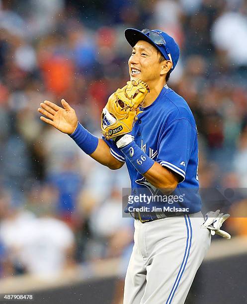 Munenori Kawasaki of the Toronto Blue Jays celebrates after defeating the New York Yankees at Yankee Stadium on September 12, 2015 in the Bronx...